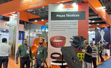 a group of people standing around a display of a variety of products